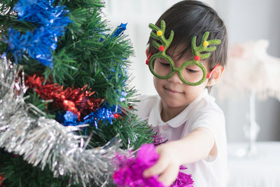 Girl holding christmas tree