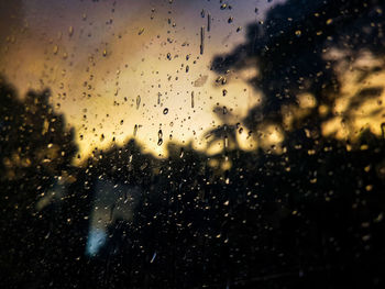 Raindrops on glass window during rainy season