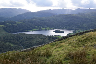 Scenic view of landscape and mountains against sky