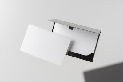 Low angle view of empty paper against white background