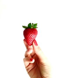 Close-up of hand holding ice cream