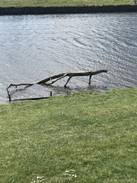 High angle view of abandoned field by lake