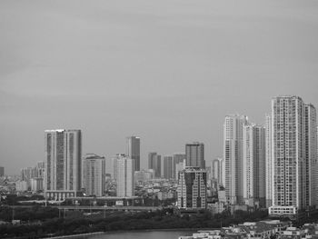 Modern buildings in city against clear sky