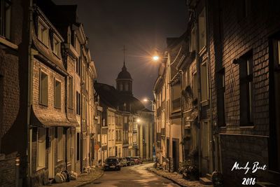 View of illuminated street lights at night