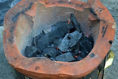 High angle view of fire on wood