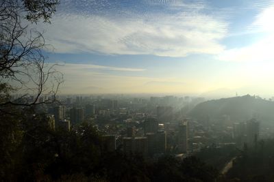 High angle view of buildings in city against sky