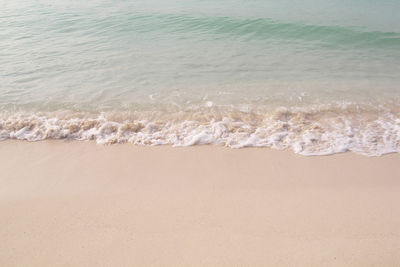 Small waves reaching the shore of the beach, caribbean beach with turquoise waters