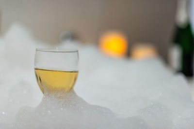 Close-up of beer glass on table