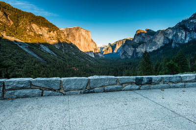 Scenic view of mountains against clear blue sky