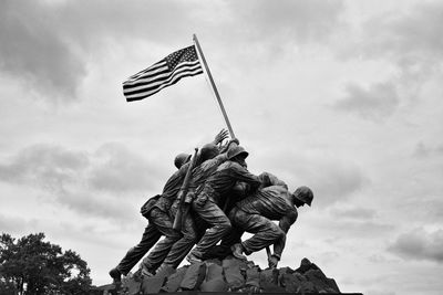 Low angle view of building against cloudy sky