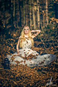 Portrait of young woman in forest