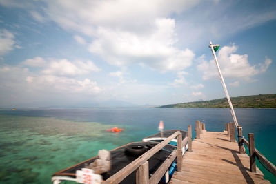 Pier over sea against sky