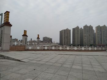 Buildings in city against sky