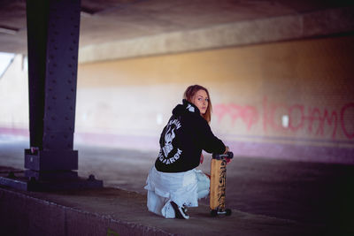 Full length of woman looking at camera