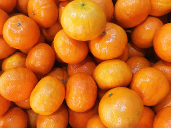 Full frame shot of oranges at market stall