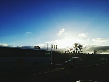 Cars on road against sky