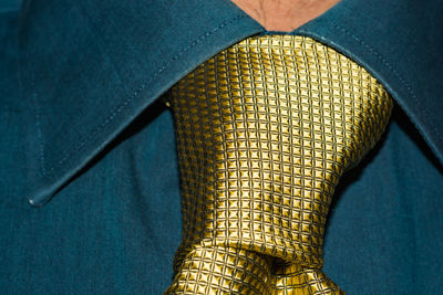 Midsection of man wearing necktie