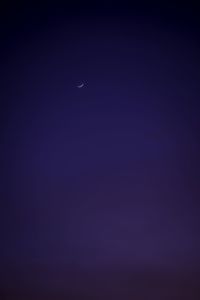 Low angle view of moon in sky at night