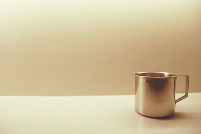 Close-up of coffee cup on table