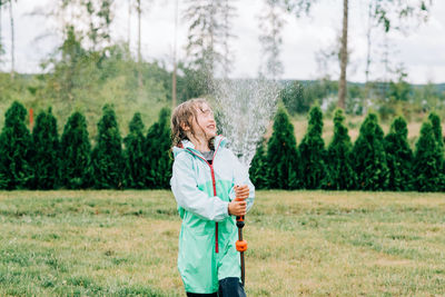 Full length of woman standing on field