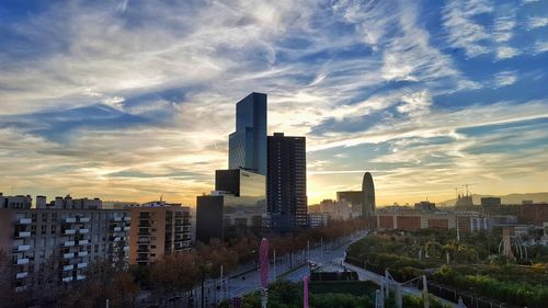 Cityscape against sky during sunset