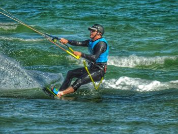 People surfing in sea