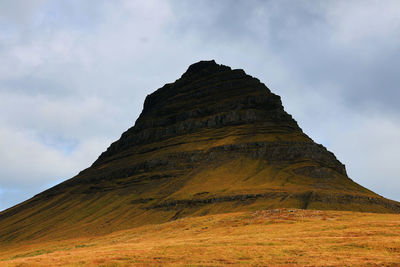 Low angle view of rock formations against sky