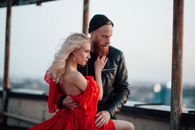 Hipster couple standing outdoors