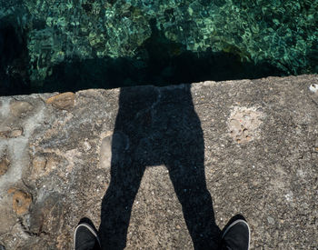 Low section of man standing on floor