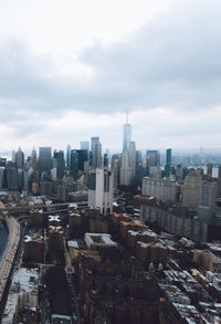 High angle view of modern buildings in city against sky