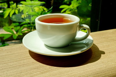 Close-up of coffee cup on table