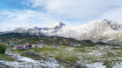 Scenic view of snowcapped mountains against sky