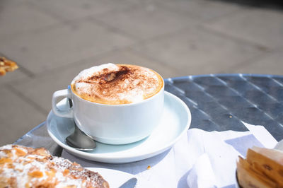 Close-up of cappuccino on table