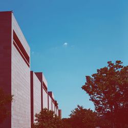 Low angle view of built structure against clear blue sky