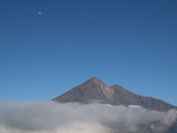 Low angle view of mount rinjani against clear blue sky in the late afternoon 