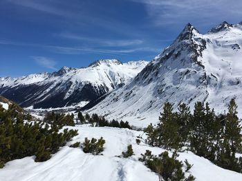 Scenic view of snowcapped mountains against sky