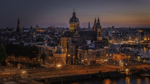 Illuminated buildings in city at night