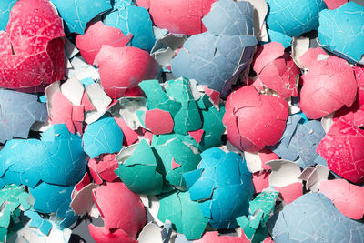 Top view of a colourful crushed eggshells