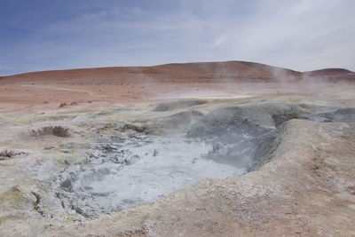 Scenic view of volcanic landscape against sky