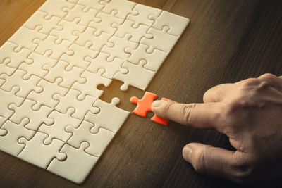 High angle view of person hand on the floor