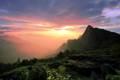 Scenic view of mountains at sunset