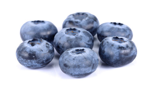 Close-up of fruits against white background