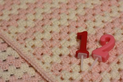 Number candles on knitted fabric