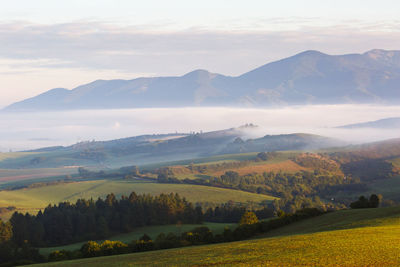 Fog in the valley of turiec region and view of mala fatra.