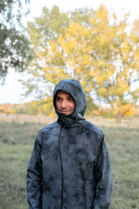 Portrait of man standing on field