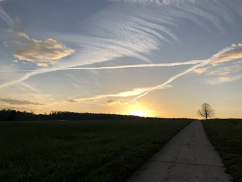 Scenic view of field against sky during sunset