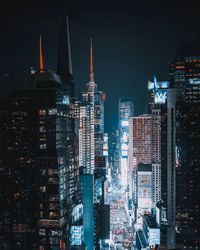 Aerial view of illuminated city at night