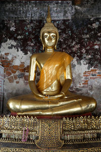 Statue of buddha outside building