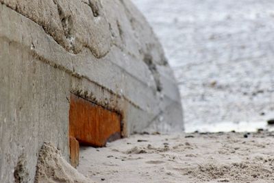 Close-up of stone wall on beach