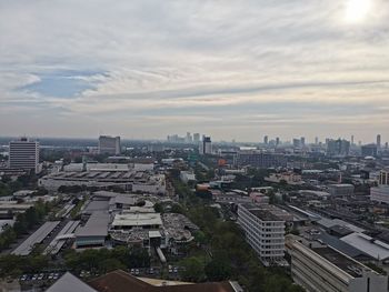 High angle view of buildings in city against sky